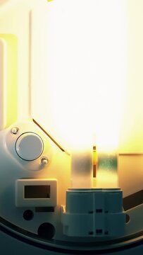 The old energy-saving lamp flickers and fades. A little ominous.
