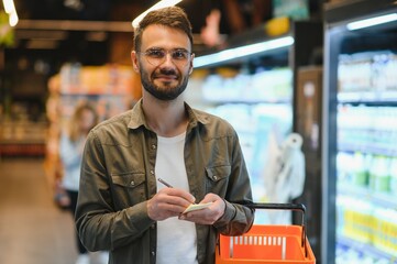 Smiling Male Customer Doing Grocery Shopping