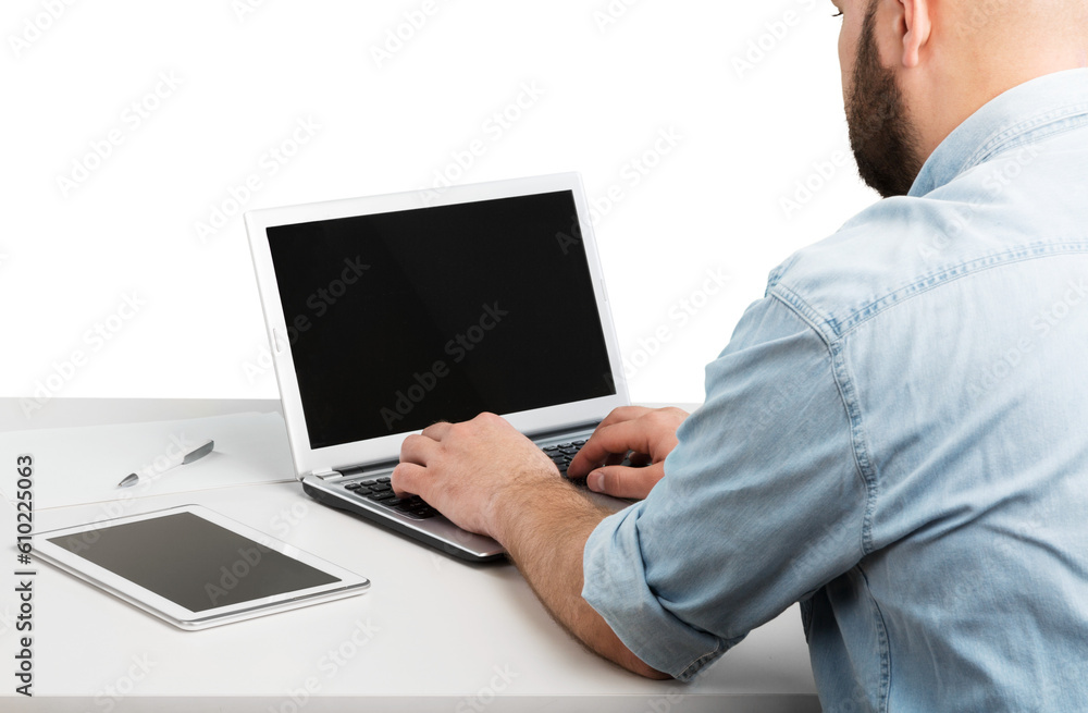 Poster man using new laptop with touchbar lying on table