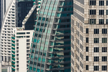 Obraz premium Exterior design of modern buildings facade in city. Details and windows of skyscrapers