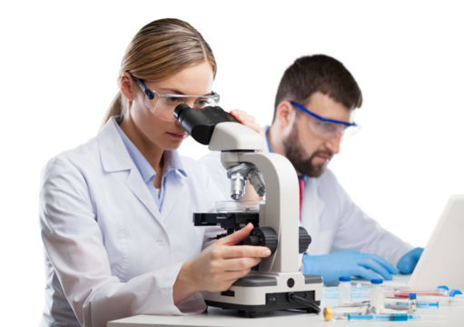 Young woman medical researcher looking through a modern microscope in a laboratory