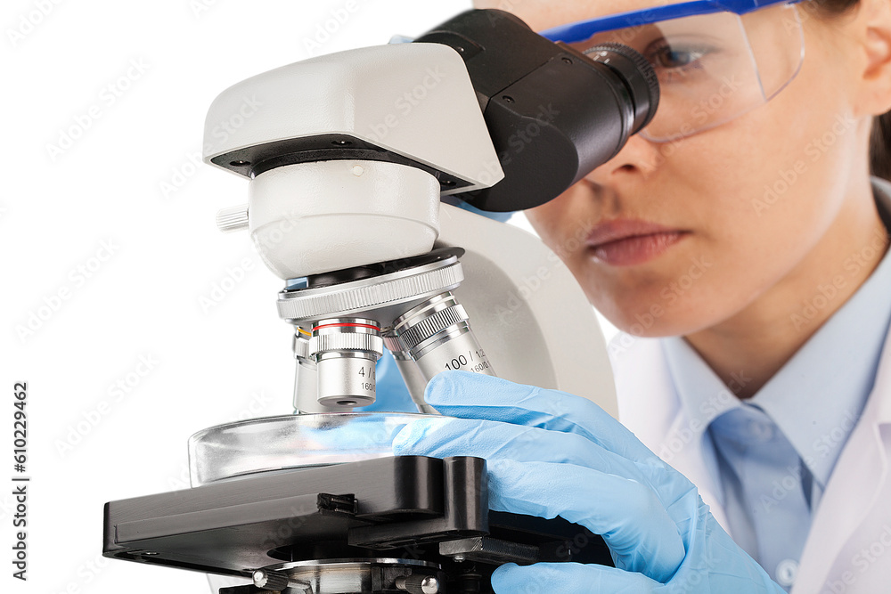 Poster young scientist doing research and looking through a microscope in a laboratory.