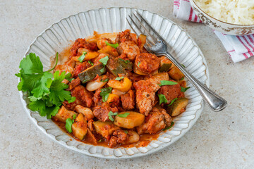 Spanish chicken stew with red wine, chorizo and vegetables