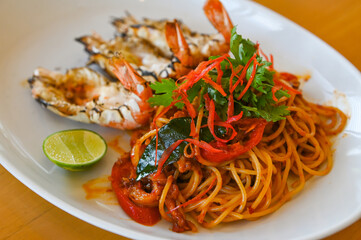 noodles plate with spaghetti pasta stir fried with vegetables herb spicy tasty appetizing asian...