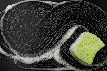 Natural Soapy Sponge with Foam, Eco Brown Sponges, Eco Friendly Hygiene Accessory on Black Background