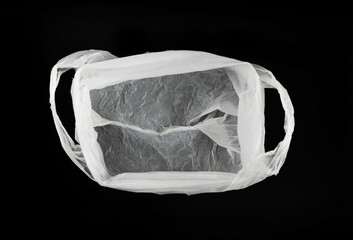 White Plastic Bags on Black Background, Crumpled Plastic Bag after Shopping, Cellophane Packaging Waste
