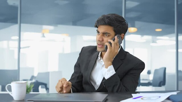 Angry Indian manager talking on phone
