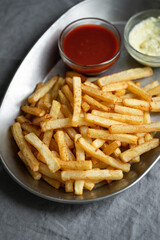 French fries in a tray with sauces