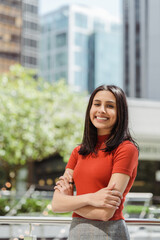 Vertical view of the happy Indian woman with toothy smile looking at camera