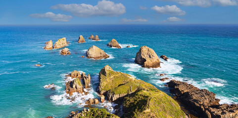 Nugget Point. It is located in the Catlins area on the Southern Coast of New Zealand - obrazy, fototapety, plakaty