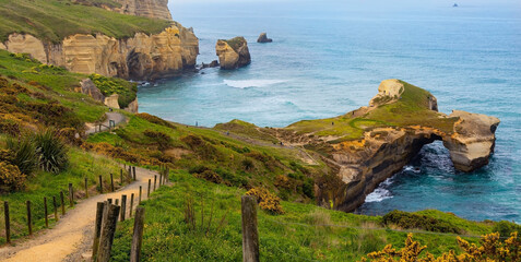 The landscape view with Scenic of Tunnel beach, Dunedin, South island of New Zealand - obrazy, fototapety, plakaty