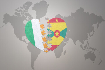 puzzle heart with the national flag of grenada and ireland on a world map background.Concept.