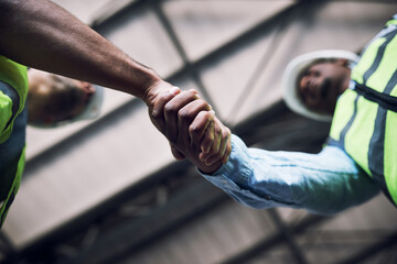 People, architect and handshake in construction, hiring or building in teamwork partnership on...