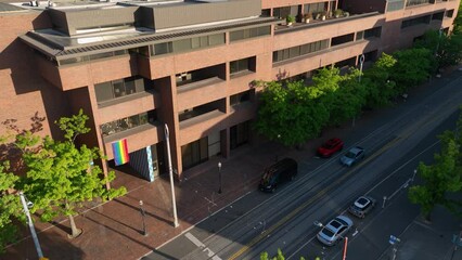 Exterior aerial view of Seattle Central's main entrance with a pride flag hanging.