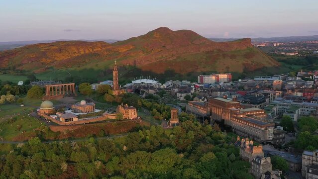 Aerial View of Edinburgh, Scotland, National Landmarks on Calton Hill and Cityscape at Sunset, Panoramic Drone Shot, UK
