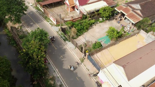 Aerial View Of Man Cycling On The Road In Siem Reap Province Cambodia