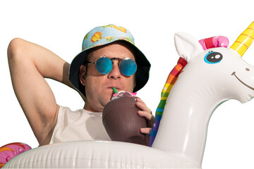 close-up, man with sunglasses and cap with float drinking a beverage from a coconut