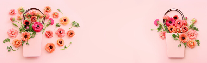 Top view image of pink flowers composition over pastel background
