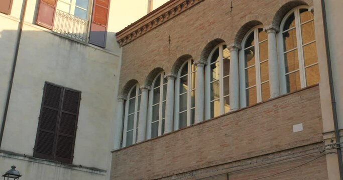 Forli, Italy: Pan shot of Historic Aurelio Saffi square in Forli, Emilia Romagna, Italy during evening time. 4K.
Forli architecture.
