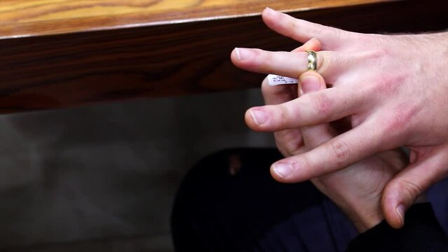hands of woman wearing wedding ring on her finger