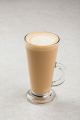 Glass mug of hot latte coffee macchiato