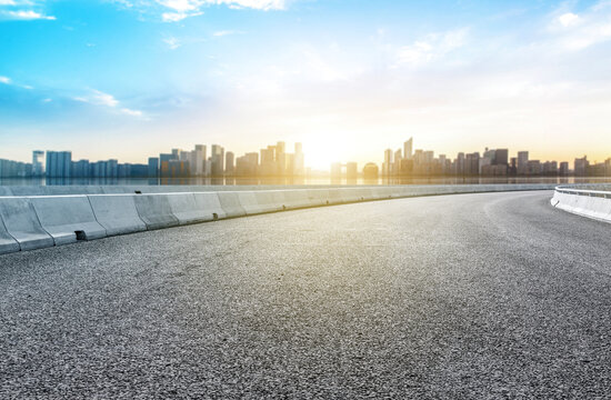 Empty road floor surface with modern city landmark buildings of Hangzhou bund Skyline, Zhejiang, china