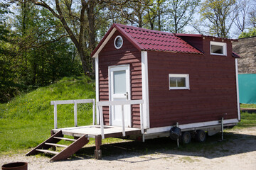 Fototapeta na wymiar red wooden mobile tiny house