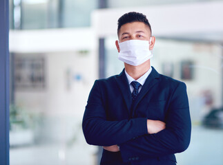 Business man, face mask and portrait with arms crossed for company work, attorney and motivation. Success, male employee and professional lawyer in law firm at office with job pride and virus safety