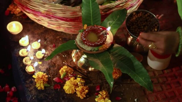 burning oil lamp with offerings during holy rituals at festival from different angle video is taken on the occasions of chhath festival which is used to celebrate in north india on Oct 28 2022.