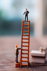 Start-up Success: Miniature Businessman Climbing the Ladder of Growth