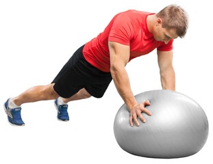 Young man doing fitness exercise on pilates ball