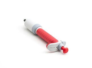 Red, automatic single-channel pipette isolated on white background
