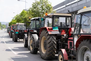 Fototapeten Farmers blocked traffic with tractors during a protest © scharfsinn86