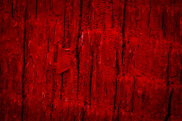 old cracked wood painted red. background or texture