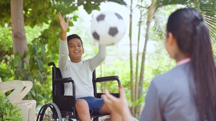 Shoulder shot of indian mother playing with son with disability on wheelchair at park - concept of supportive parent, family bonding and aspiration - Powered by Adobe