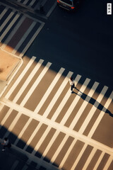 Aerial photography of people on the pedestrian crossing line.