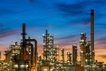 Twilight scene of tank oil refinery plant and tower column of Petrochemistry