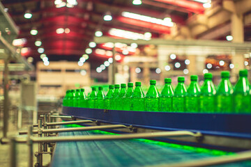 Beverage factory interior. Conveyor flowing with bottles for water