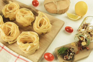 Raw and fresh homemade pasta on the table, close-up