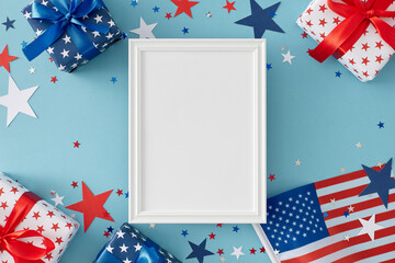 Obraz premium Idea for patriotic festivities on Independence Day. Top view flat lay of gift boxes in national colours, american flag, festive confetti on pastel blue background with empty frame for text