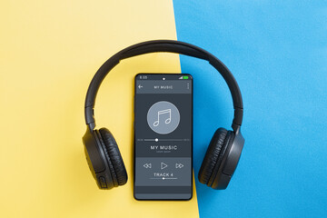 Obraz na płótnie Canvas Music player in phone, wireless headphones and phone