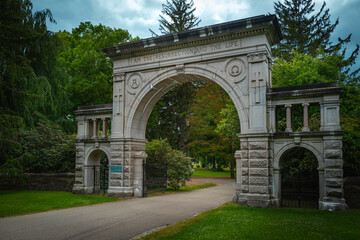 Fototapeta na wymiar Elm Grove Cemetery entrance stone gate in Mystic Connecticut