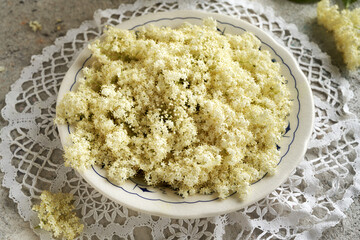 Fresh elderberry flowers in a vintage plate