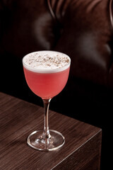 Luxury cocktail on the wooden table on a dark background