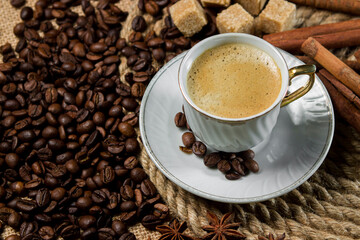 A cup of espresso on a background of coffee beans. Cup of fresh coffee