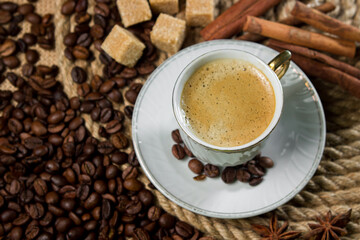 A cup of espresso on a background of coffee beans. Cup of fresh coffee