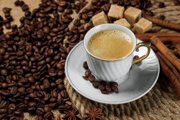 A cup of espresso on a background of coffee beans. Cup of fresh coffee