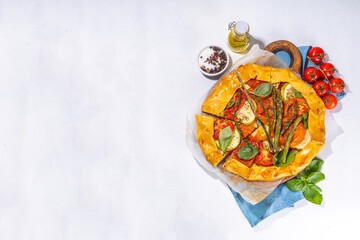 Fresh baked homemade vegetable vegan pie, Crunchy savoury galette tart  with olives, zucchini,...