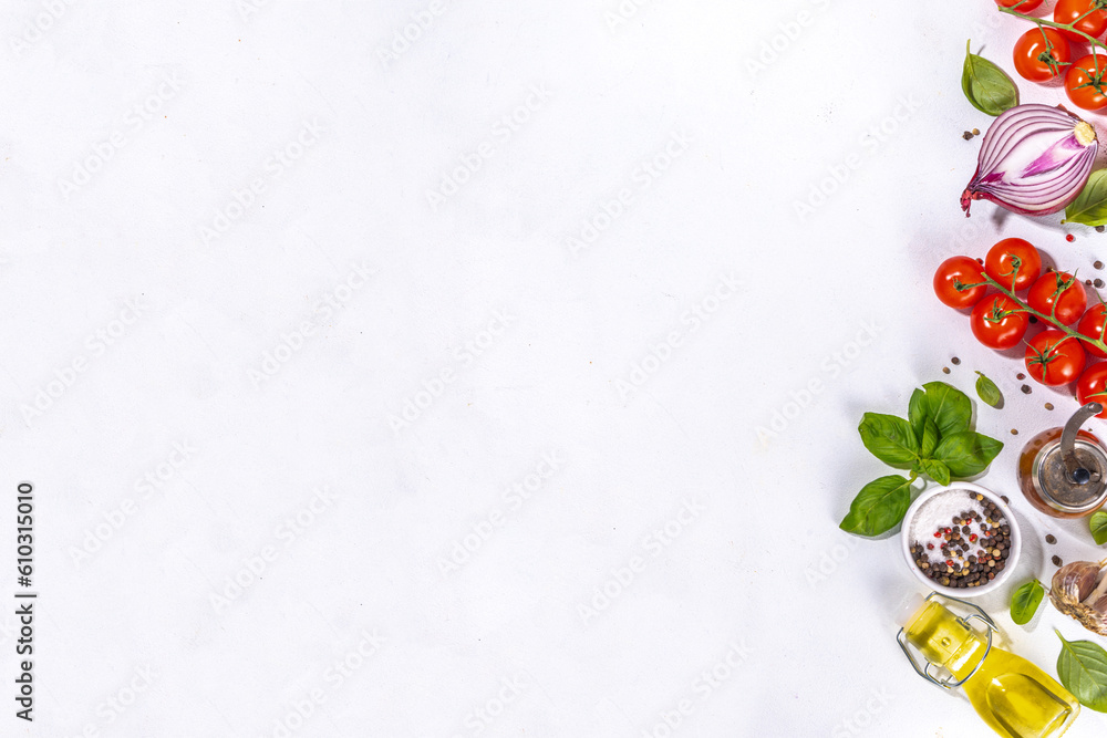 Wall mural White cooking background with useful cooking italian Mediterranean ingredients - tomatoes, basil leaves, greens, olive oil, salt, pepper, garlic, flat lay white table top view copy space 