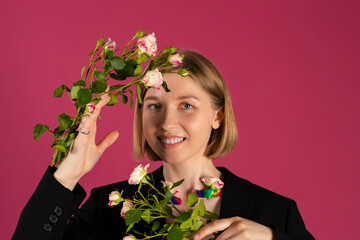 Portrait of a Beautiful tender young blonde hair girl with the Flowers are growing out of the...